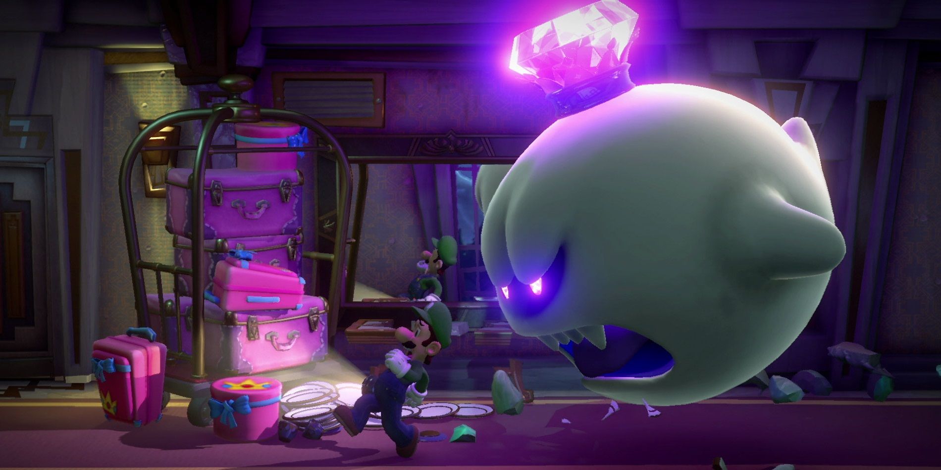 Luigi runs away from King Boo in Luigi's Mansion 3
