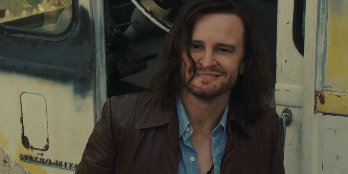 Charles Manson grins by his truck in Once Upon A Time In Hollywood