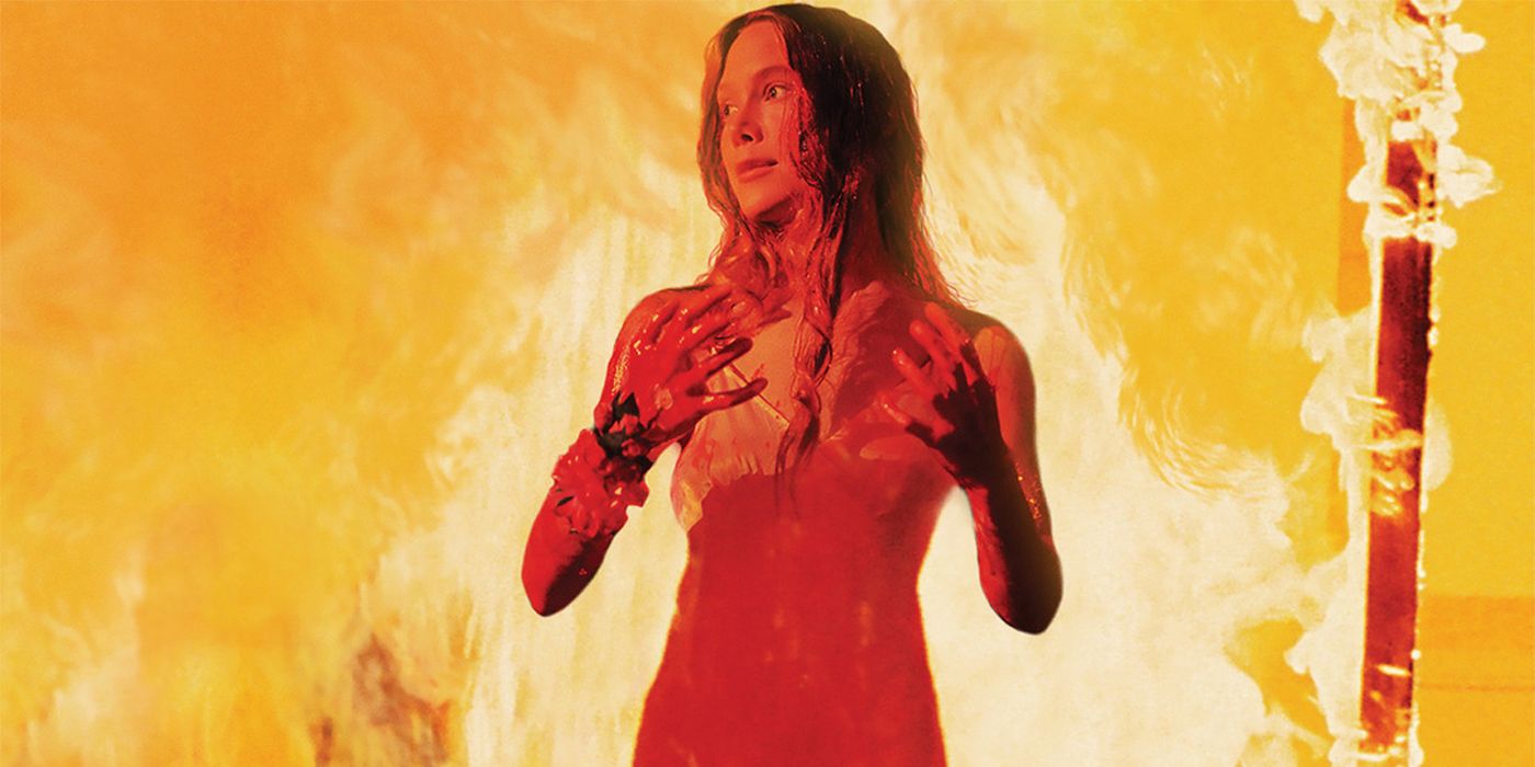 Carrie covered in blood with fire raging behind her