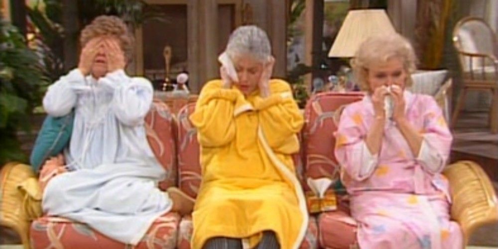 Blanche, Dorothy, and Rose suffer from the flu on the couch in the living room on the Golden Girls. 