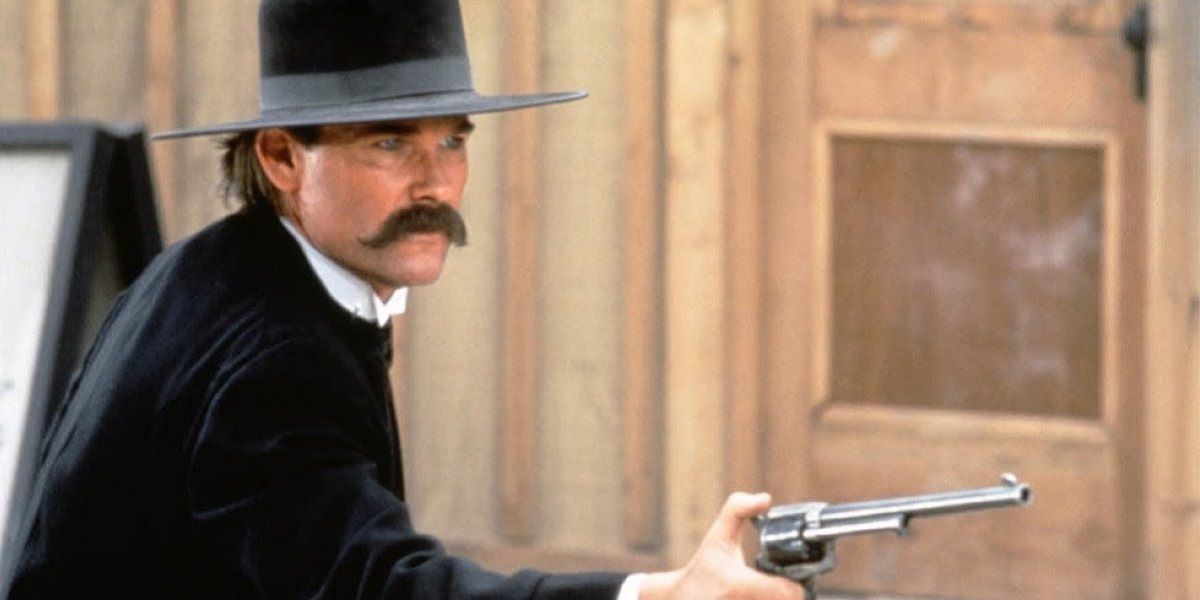 Wyatt Earp points his gun at someone