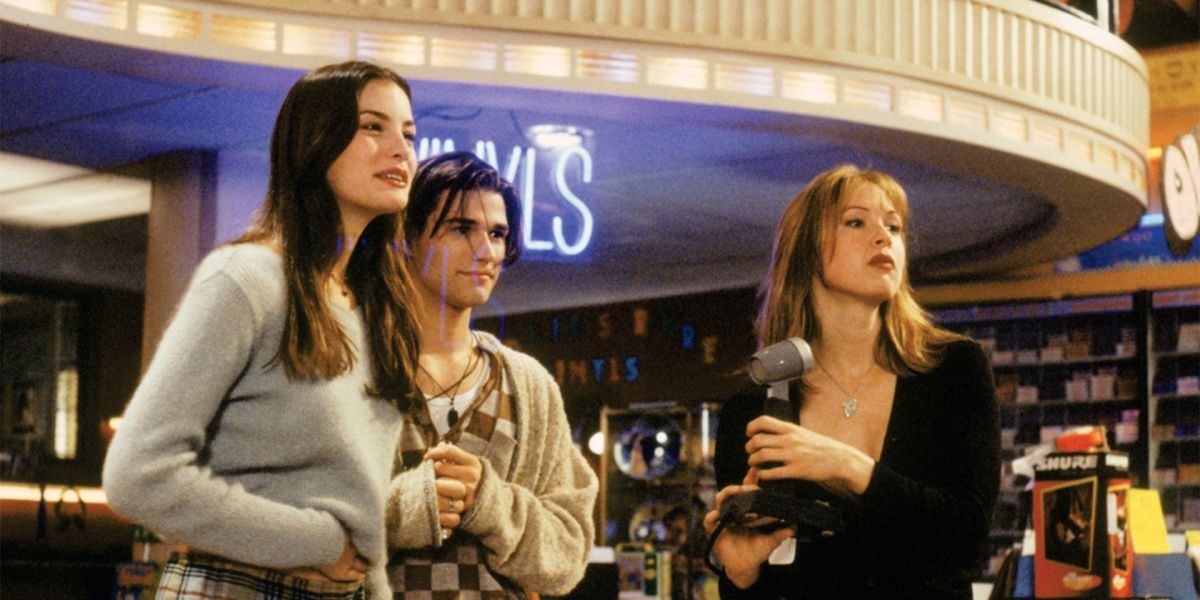 Corey, A.J., and Gina stand in the front of the store in Empire Records.