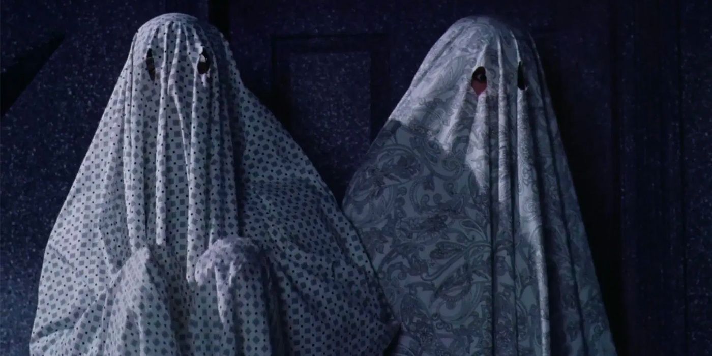 Adam and Barbara disguised as ghosts in Beetlejuice.