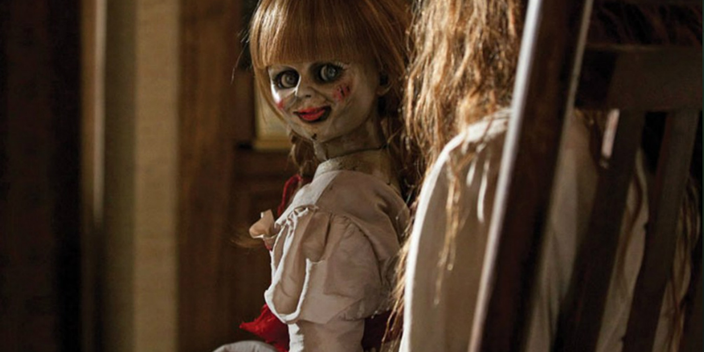 The Annabelle doll from The Conjuring looking at the camera