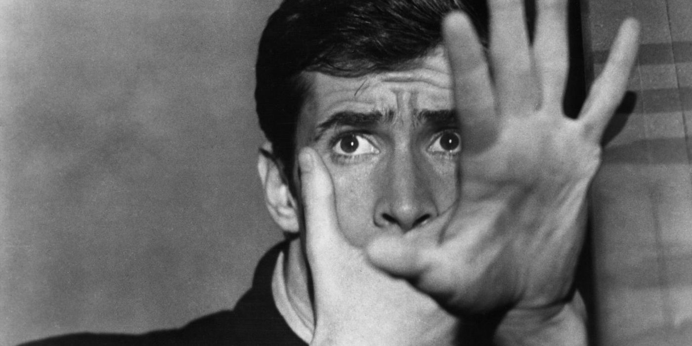 Norman Bates holding up his hand.
