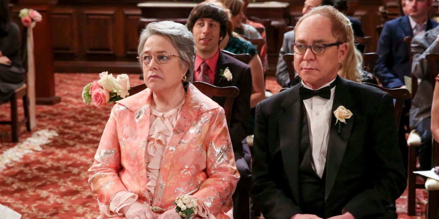 Amy's parents sitting at her wedding on The Big Bang Theory