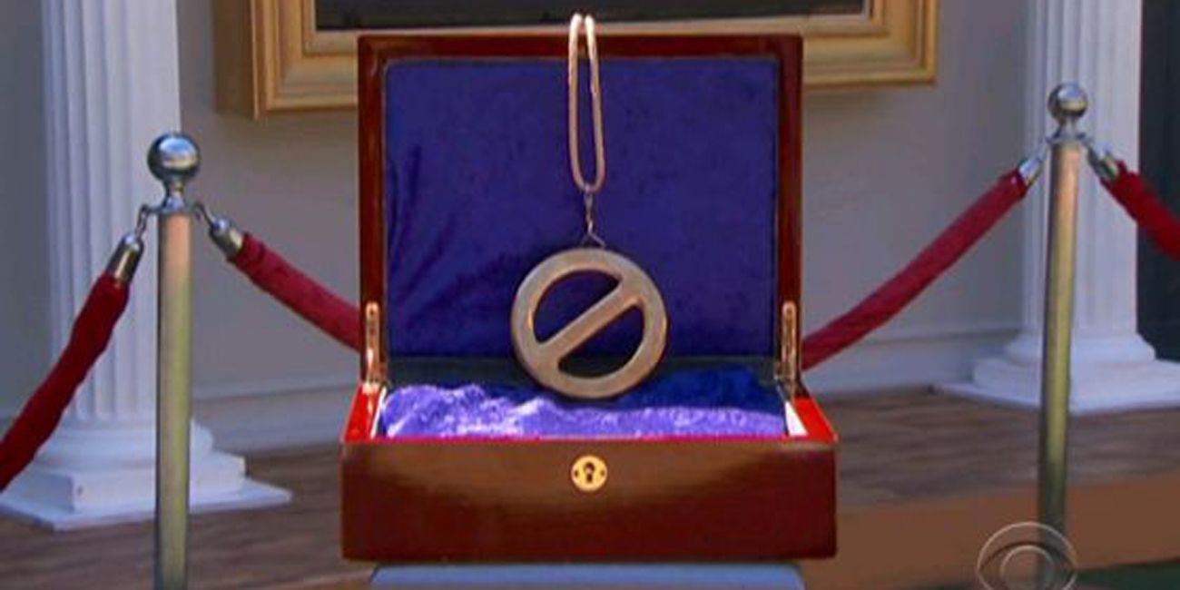 A golden chain inside a red box representing the Power of Veto in Big Brother
