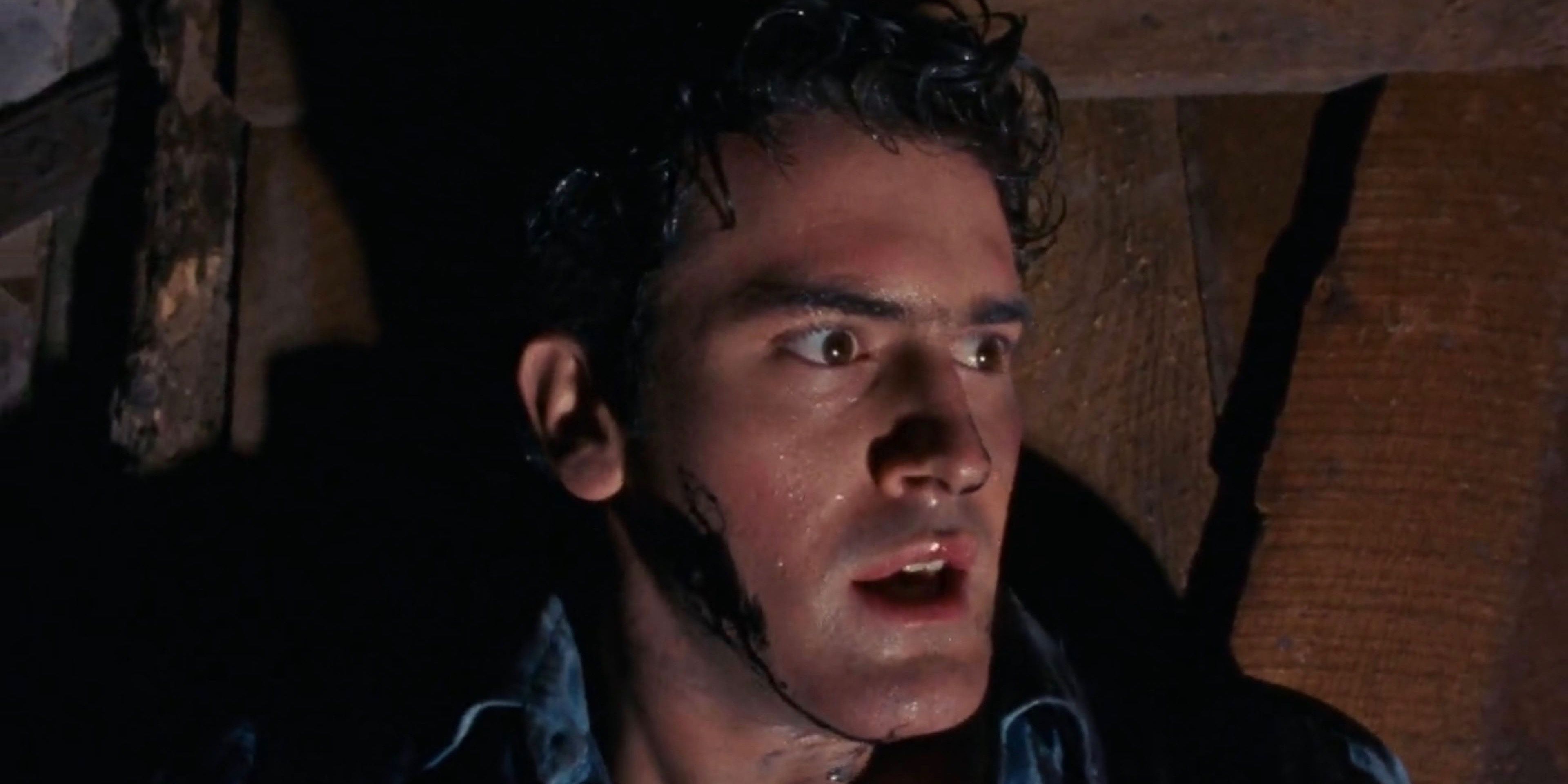 Bruce Cambell as Ash Williams looking concerned in Evil Dead