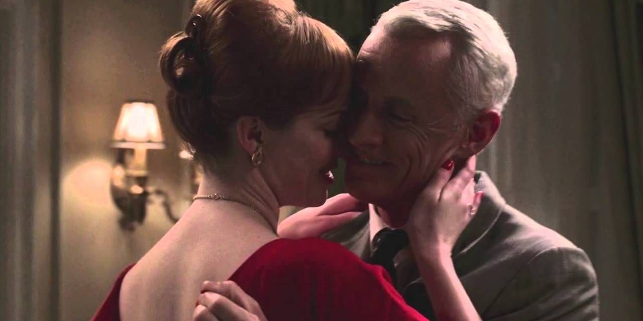 Joan and Roger embracing in Mad Men