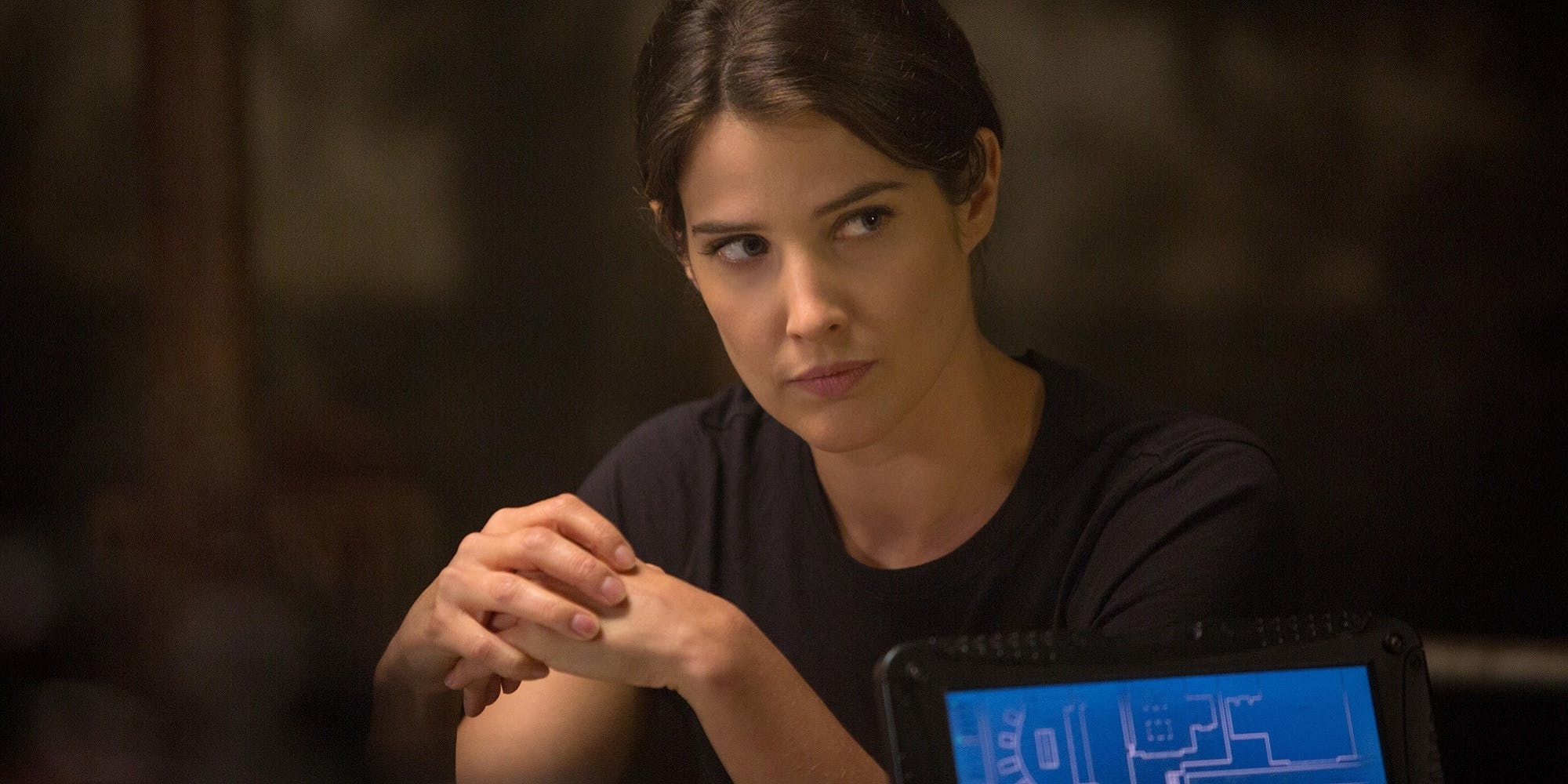 Maria Hill sits and looks to the side