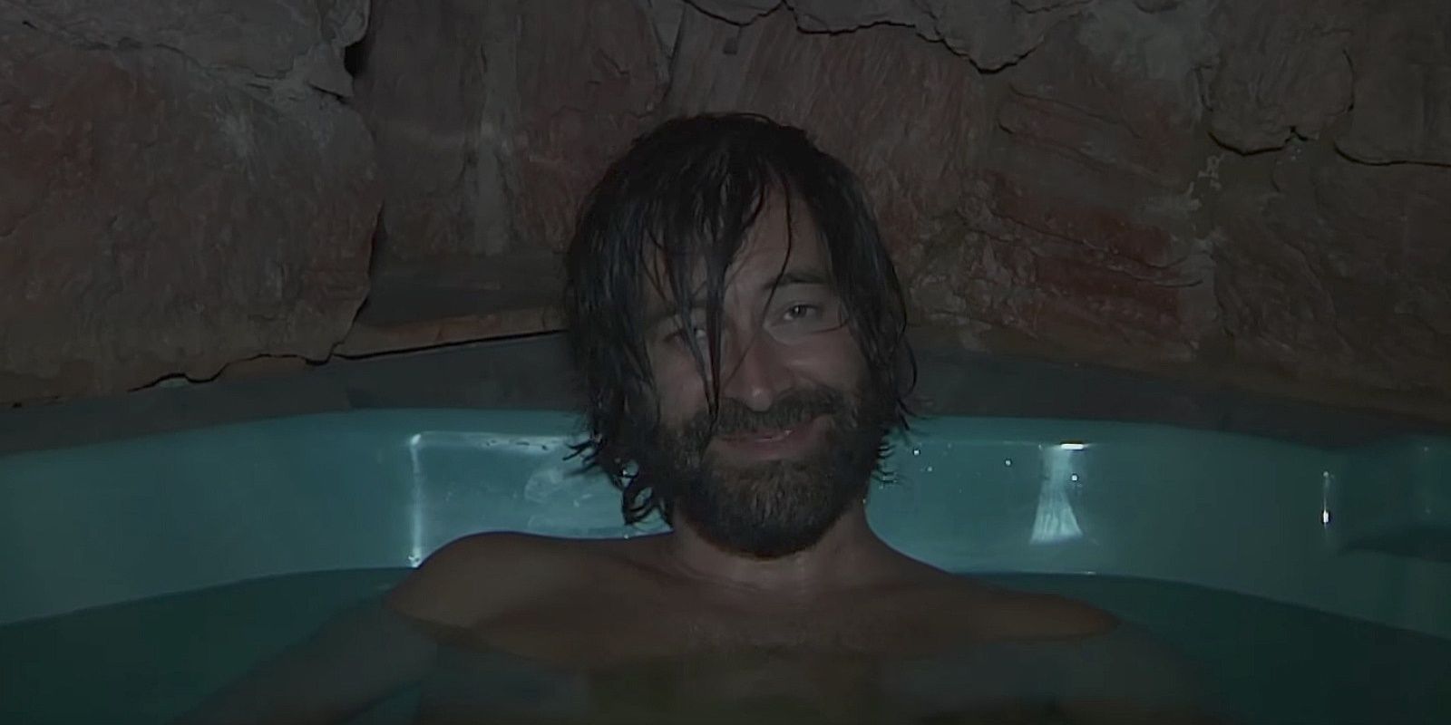 Aaron smiling in the bath in Creep 2