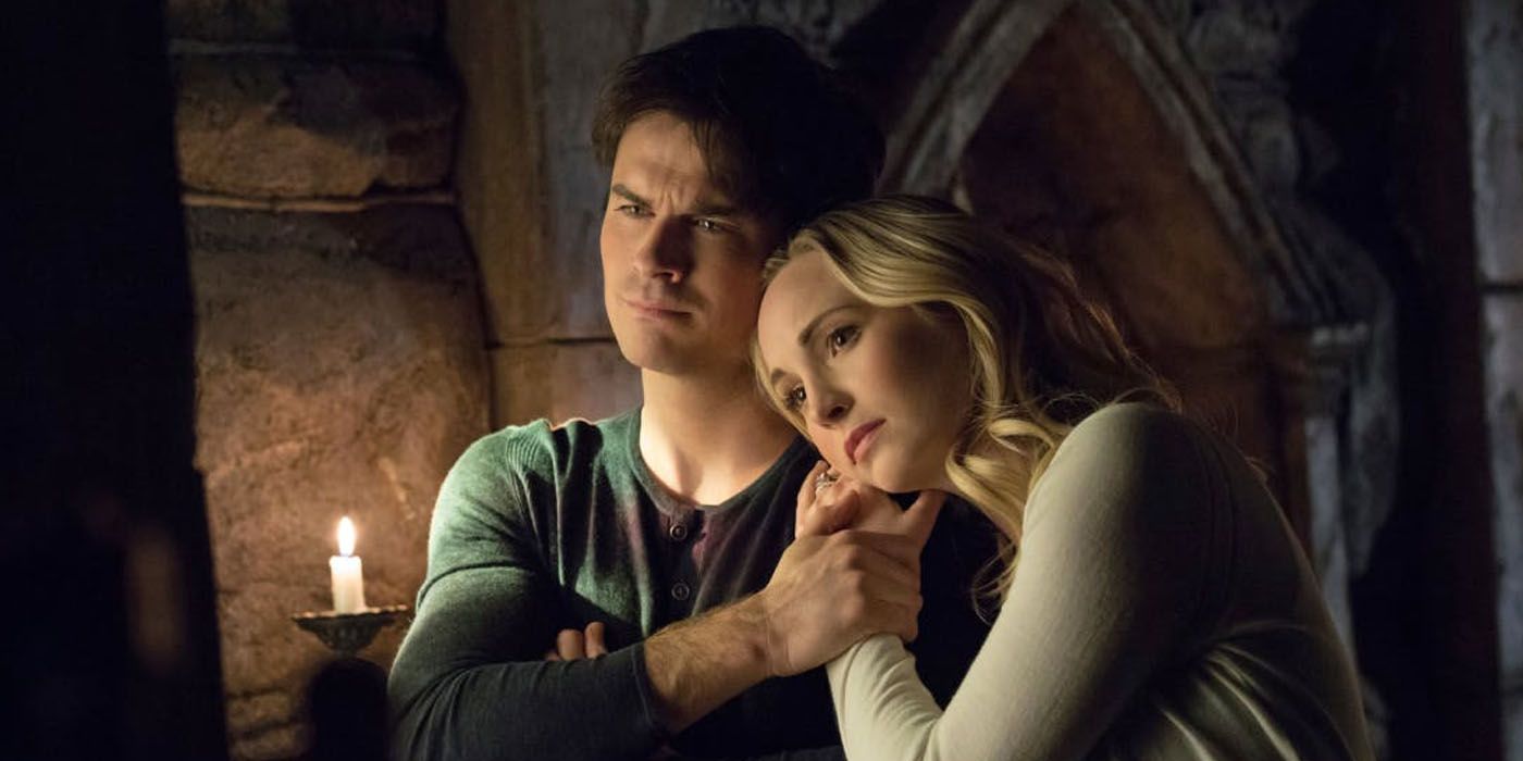 Caroline leans against Damon in The Vampire Diaries