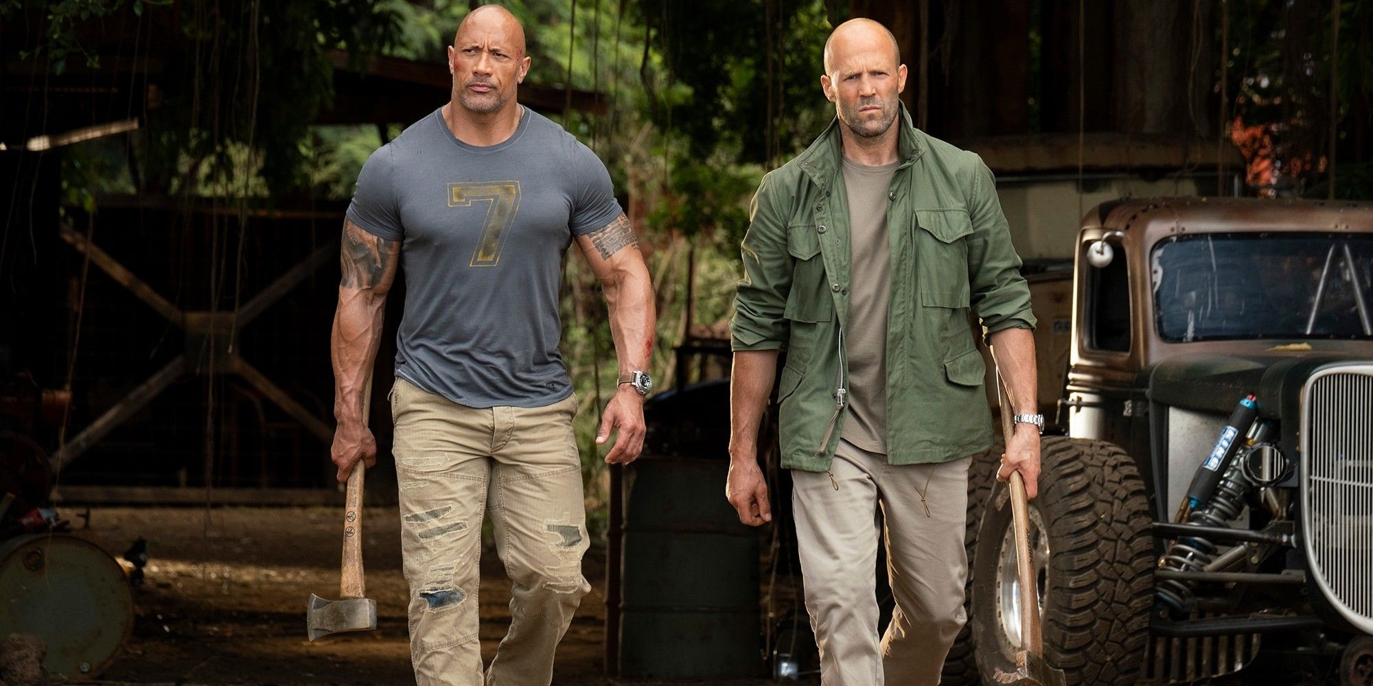Hobbs and Shaw with weapons in their hands 