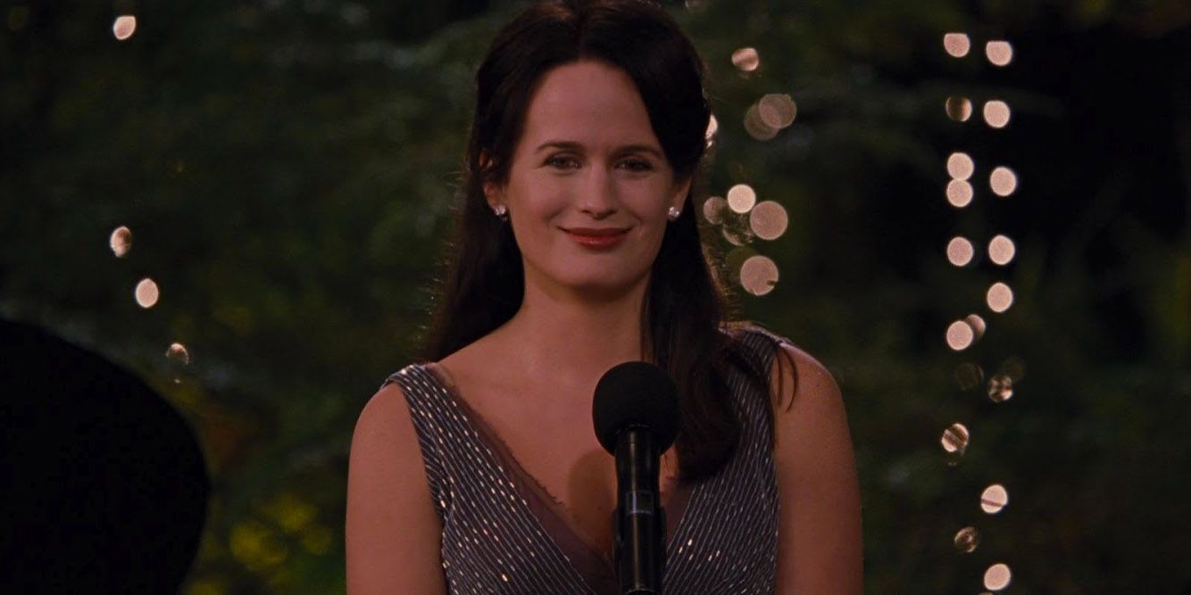 Esme Cullen standing in front of a microphone