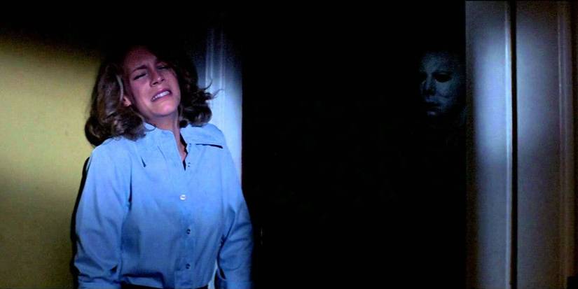 Michael Myers stalking Laurie Strode in Halloween.