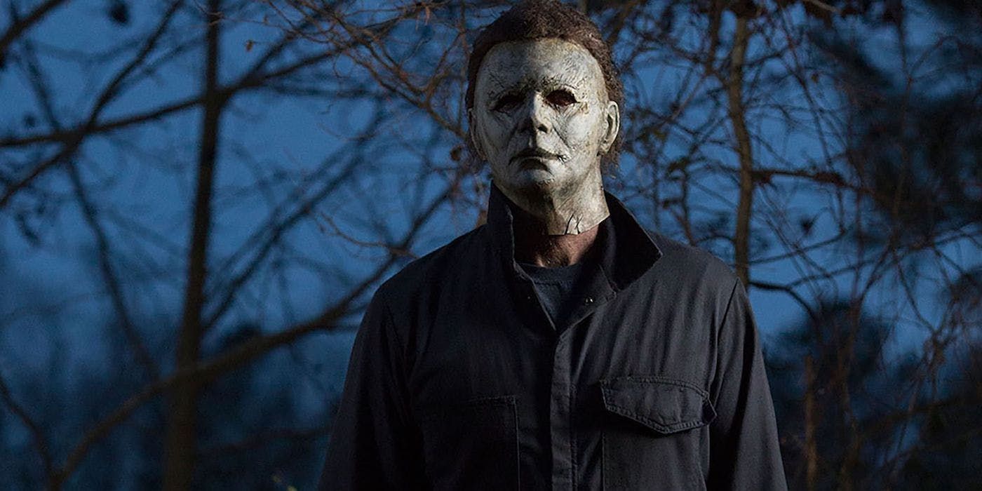 Michael Myers standing in the woods in Halloween