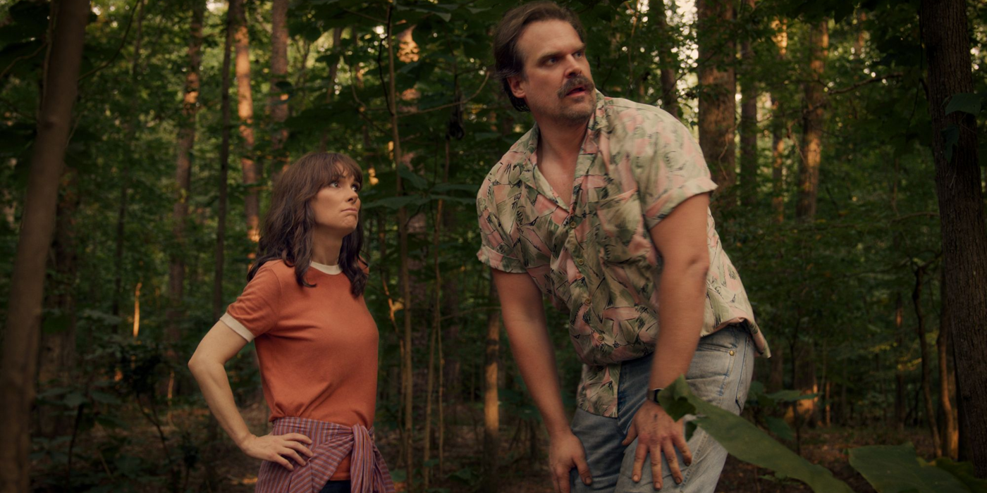 Hopper and Joyce in the woods in Stranger Things