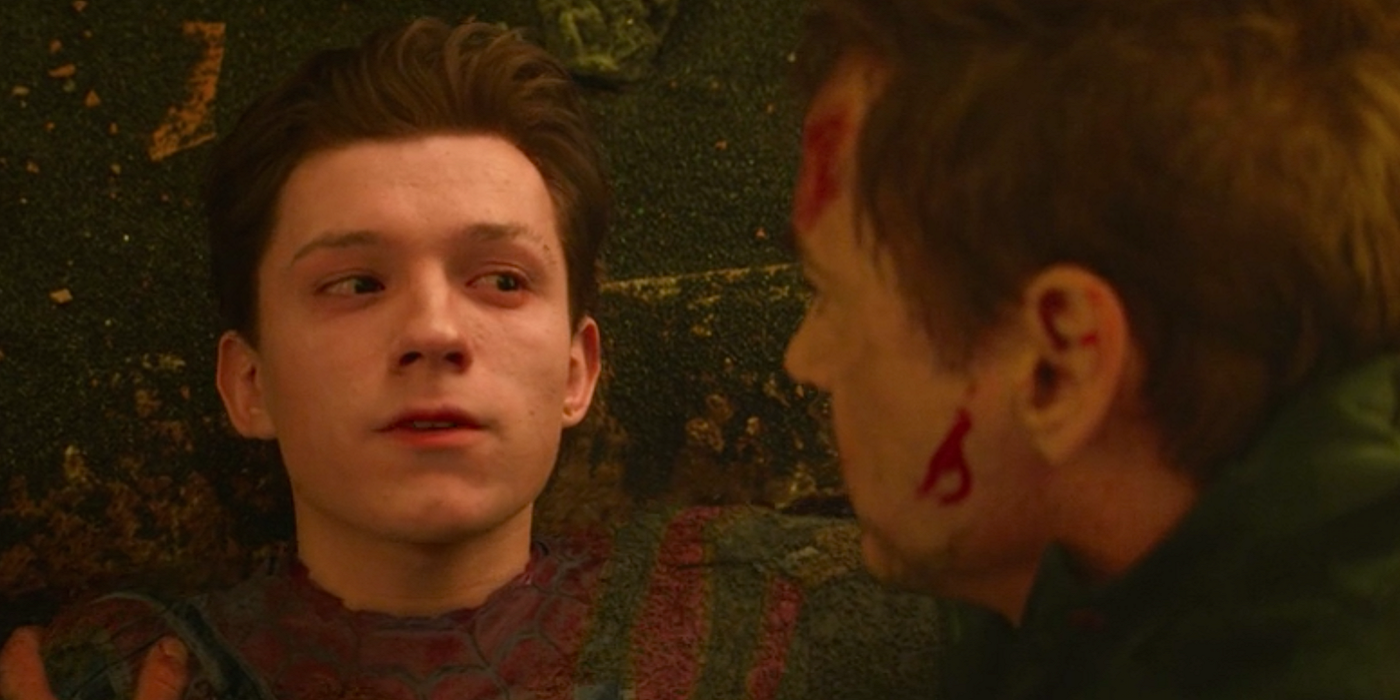 Spider-Man looks at Tony while lying on the ground in Avengers: Infinity War.
