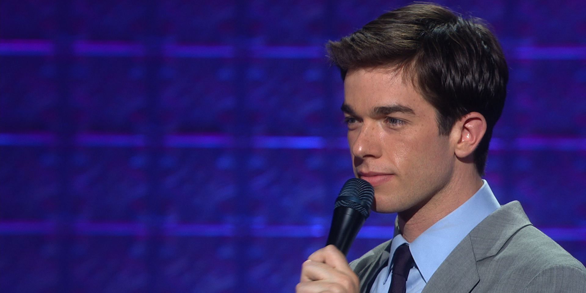 A young John Mulaney performs standup comedy