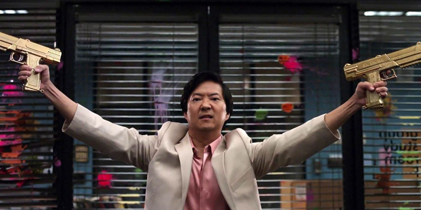 Chang holding two paintball guns in the air in Community
