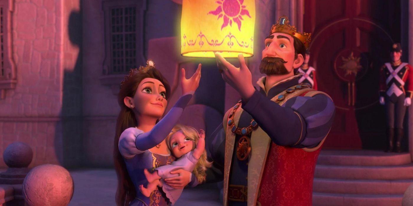 King Frederic and Queen Arianna holding Rapunzel while looking a the lights on Tangled