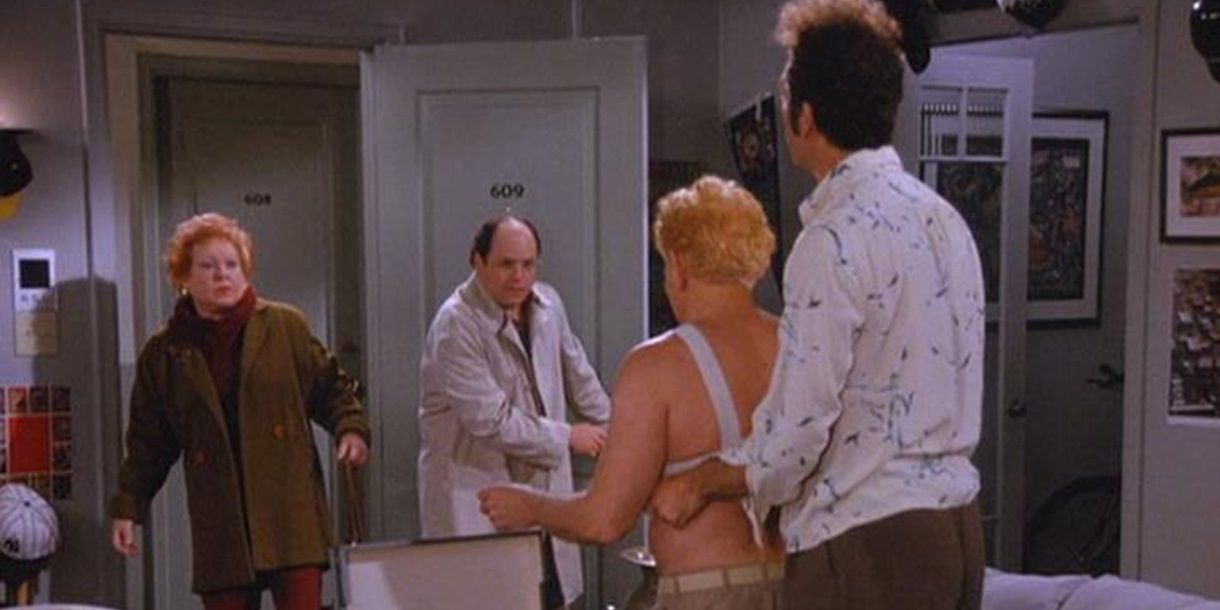 Kramer fits Frank for a man-bra as George walks in on them in Seinfeld