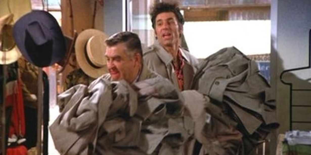Kramer and Morty carrying dozens of raincoats