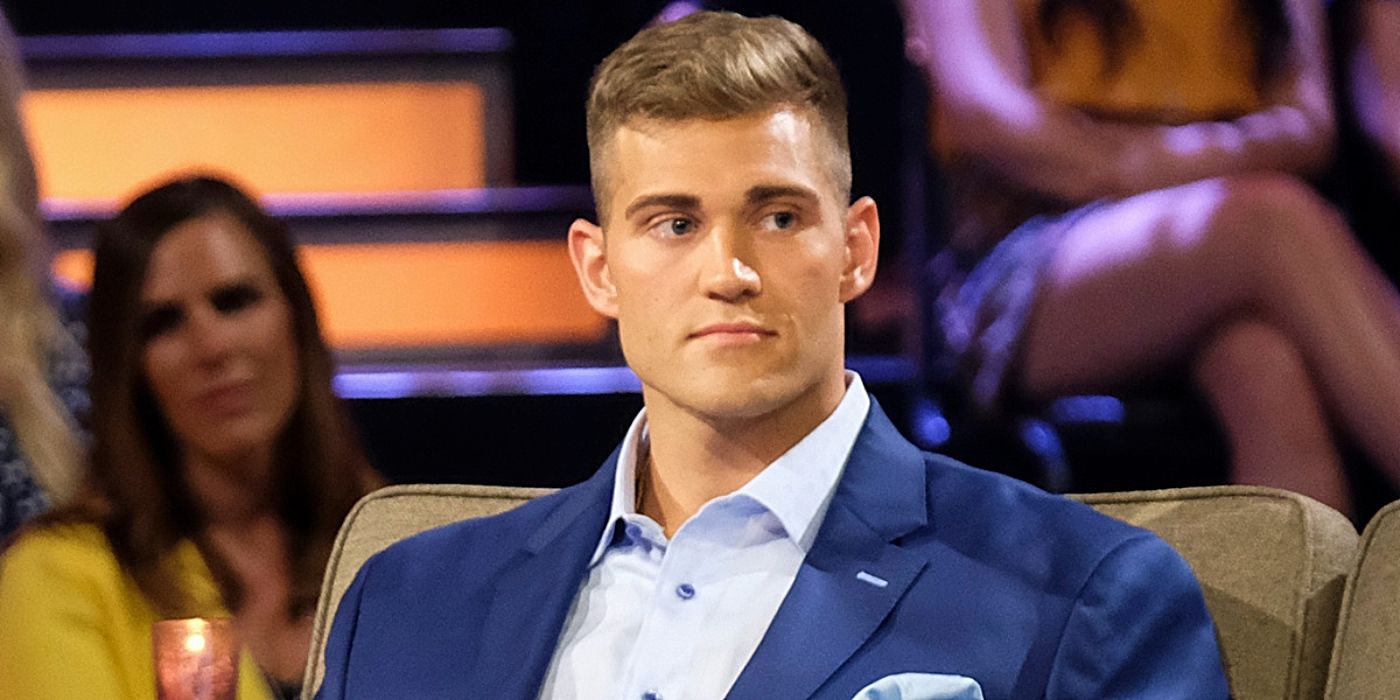 Luke Parker in a blue suit looking unhappy on The Bachelorette