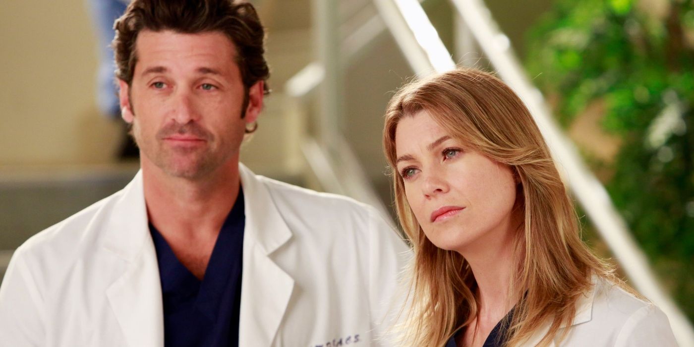 Derek and Meredith standing together looking concerned on Grey's Anatomy