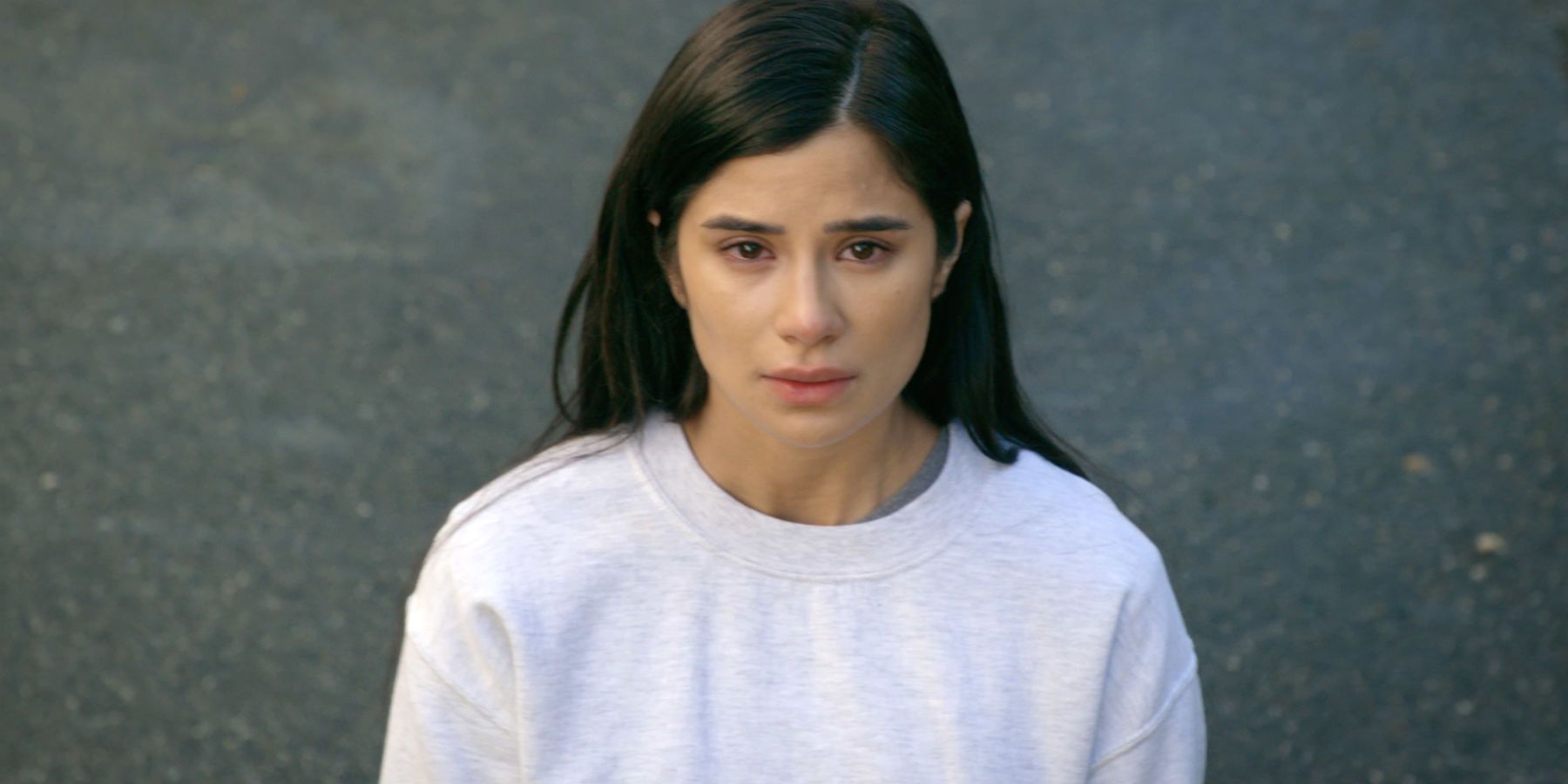 Maritza looking at something in Orange is the New Black .