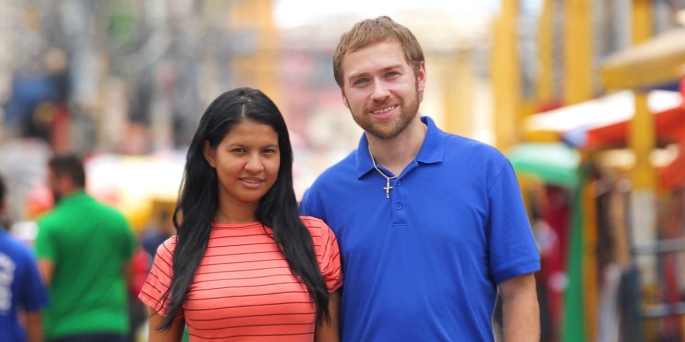 Paul Staehle and Karine Martins standing together and smiling for the camera in 90 Day Fiance