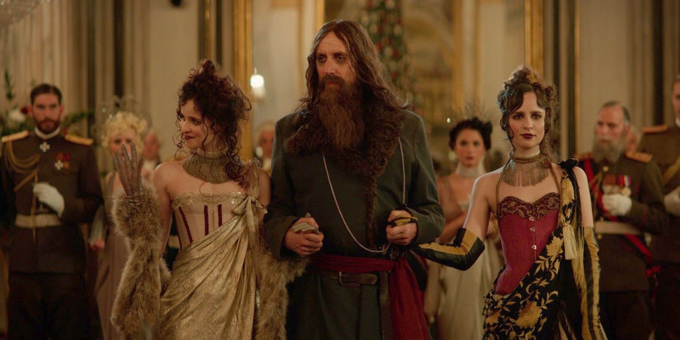 Rhys Ifans as Rasputin at a ball with two women in The King's Man