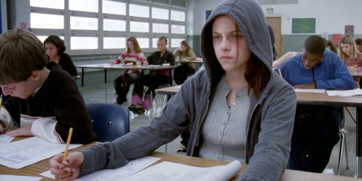 A young girl looks on while wearing a hoodie in Speak
