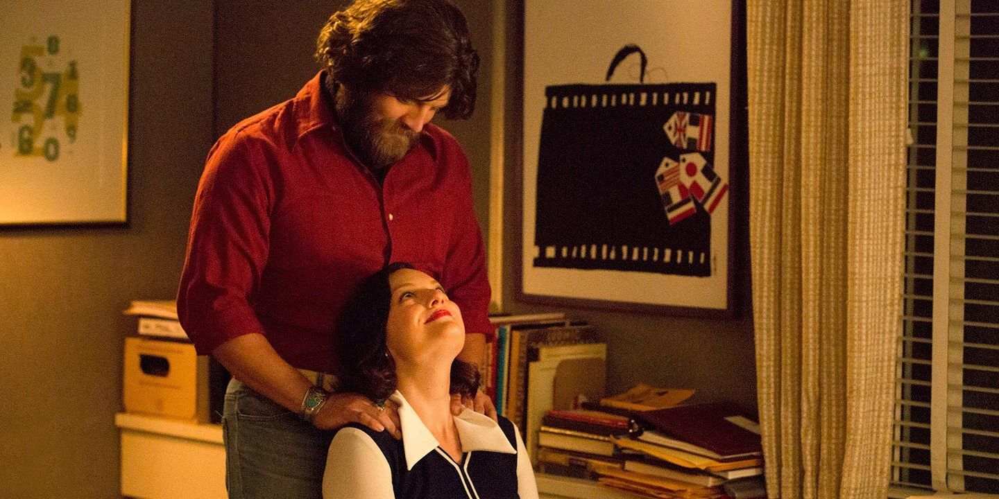 Stan massages Peggy in Mad Men
