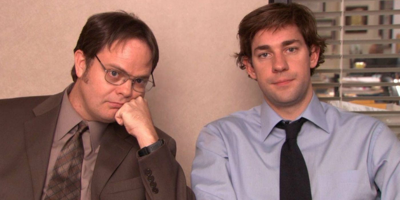 Dwight and Jim sitting next to each other talking to the camera on The Office,