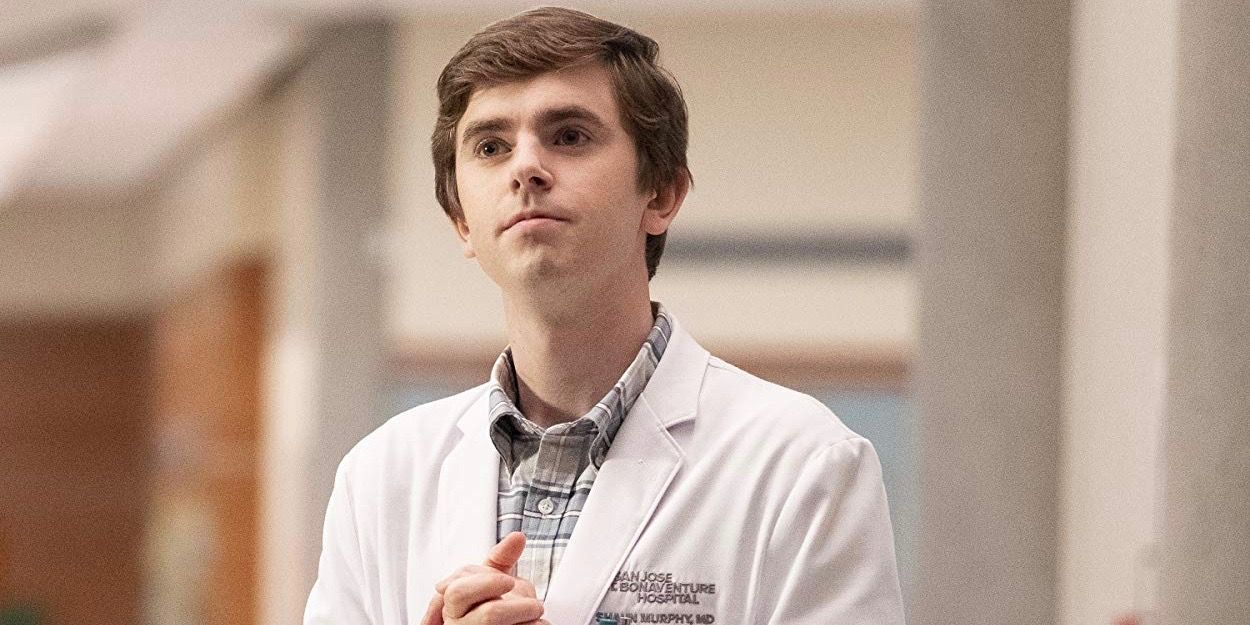 Shaun wearing his white coat and clasping his hands in The Good Doctor.