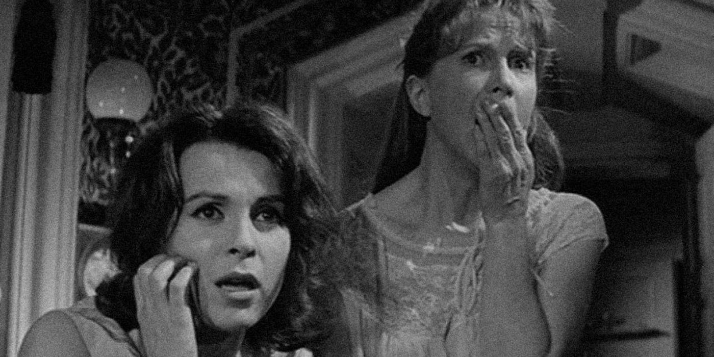 Two women gasp in fright in the original Haunting