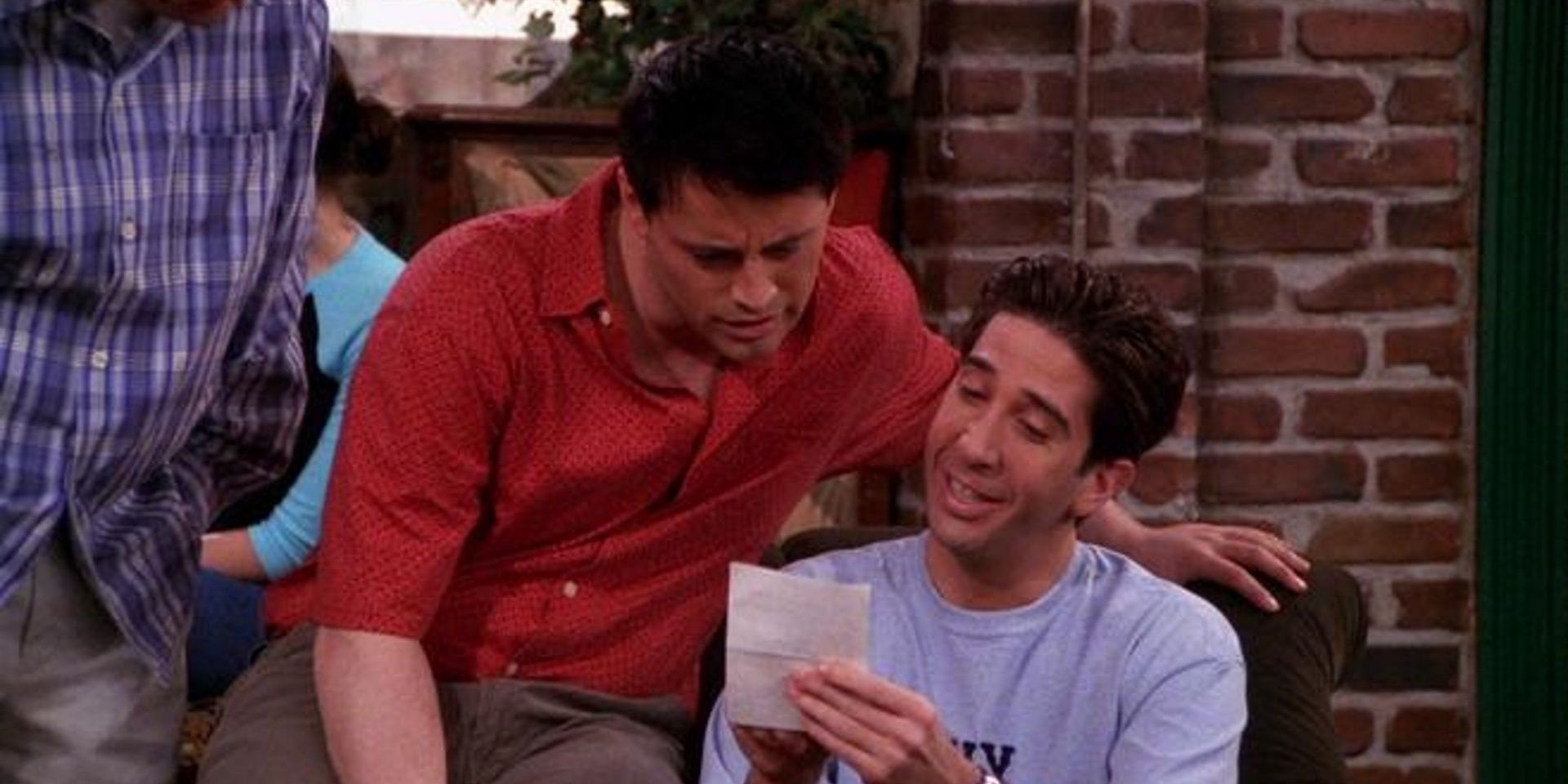 Chandler, Joey and Ross in Central Perk reading vows