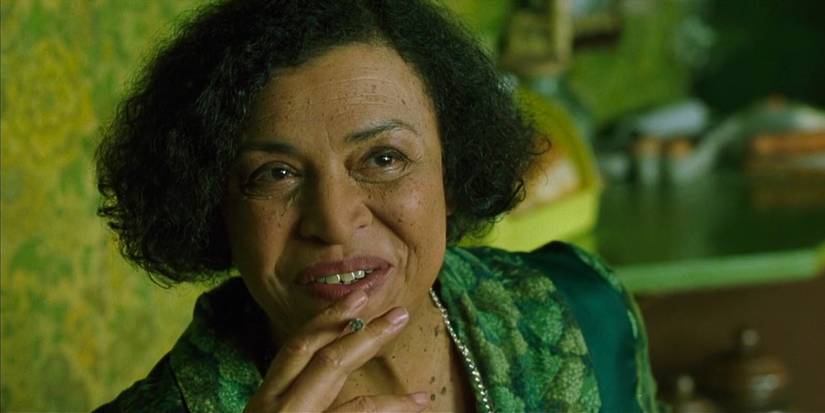 The Oracle smiling in The Matrix