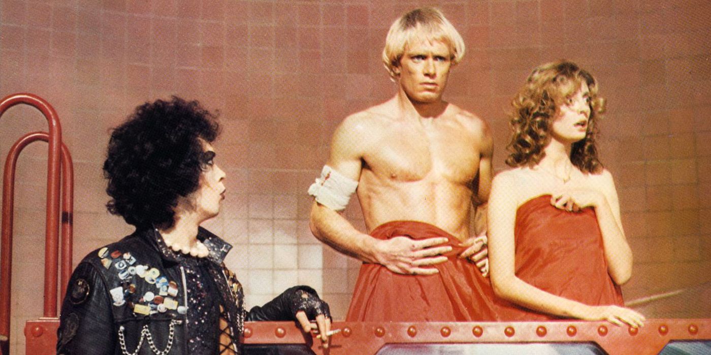 Frank N. Furter (Tim Curry) catches Rocky (Peter Hinwood) and Janet (Susan Sarandon) together in Rocky Horror Picture Show