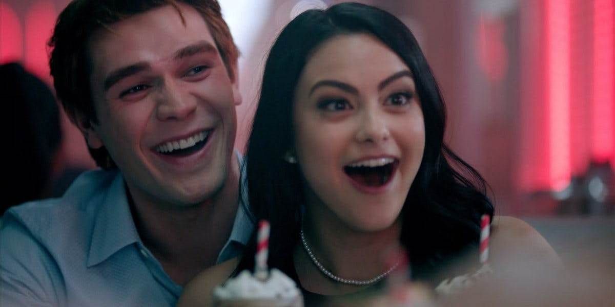 Archie and Veronica having a good laugh in Riverdale