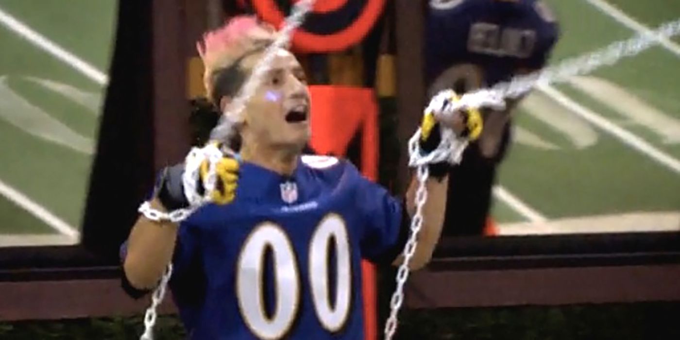 Frankie holding two ropes during a two-person competition on Big Brother, looking panicked.