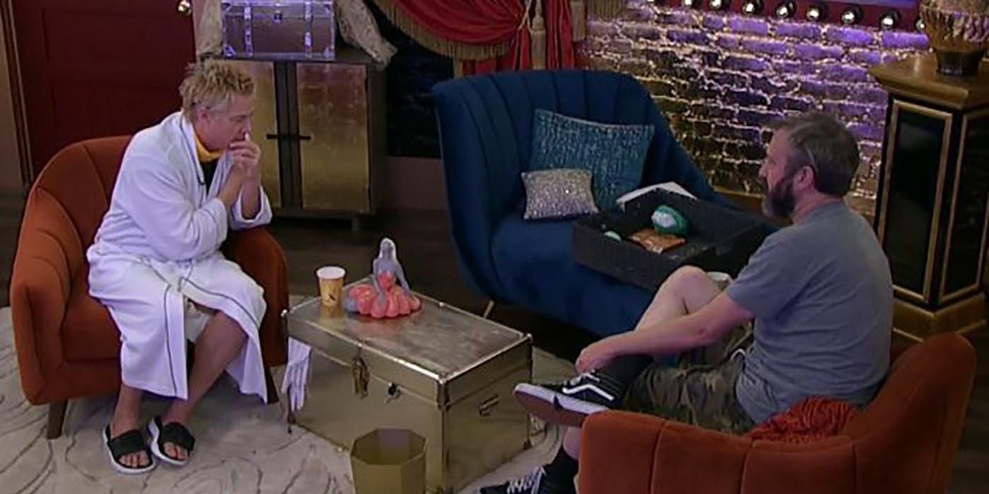 A Big Brother camera capturing Kath and Tom sitting together and chatting in the house.