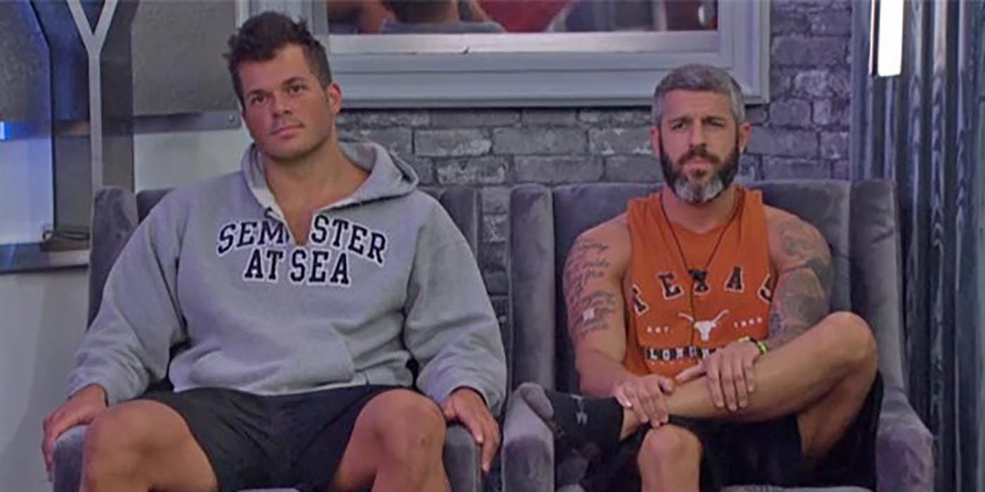 Two male players sitting on the block on Big Brother.