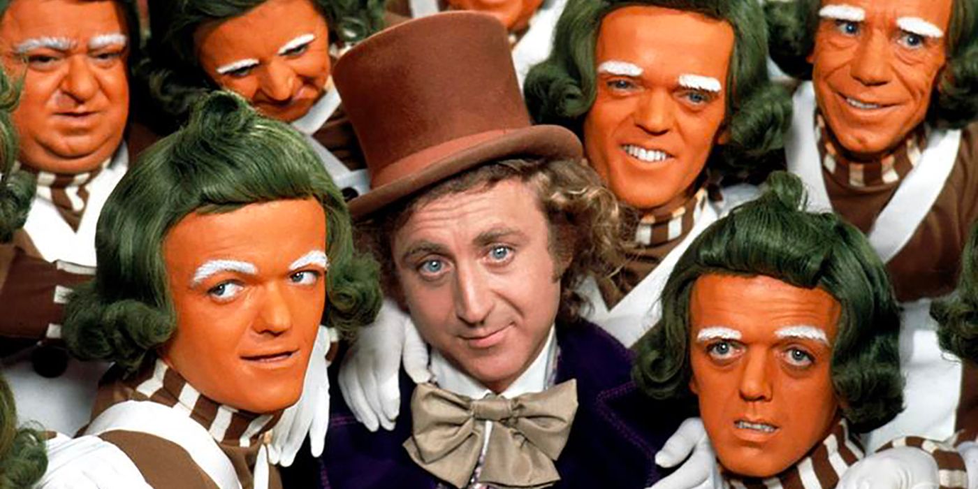 Willy Wonka (Gene Wilder) surrounded by Oompa Loompas
