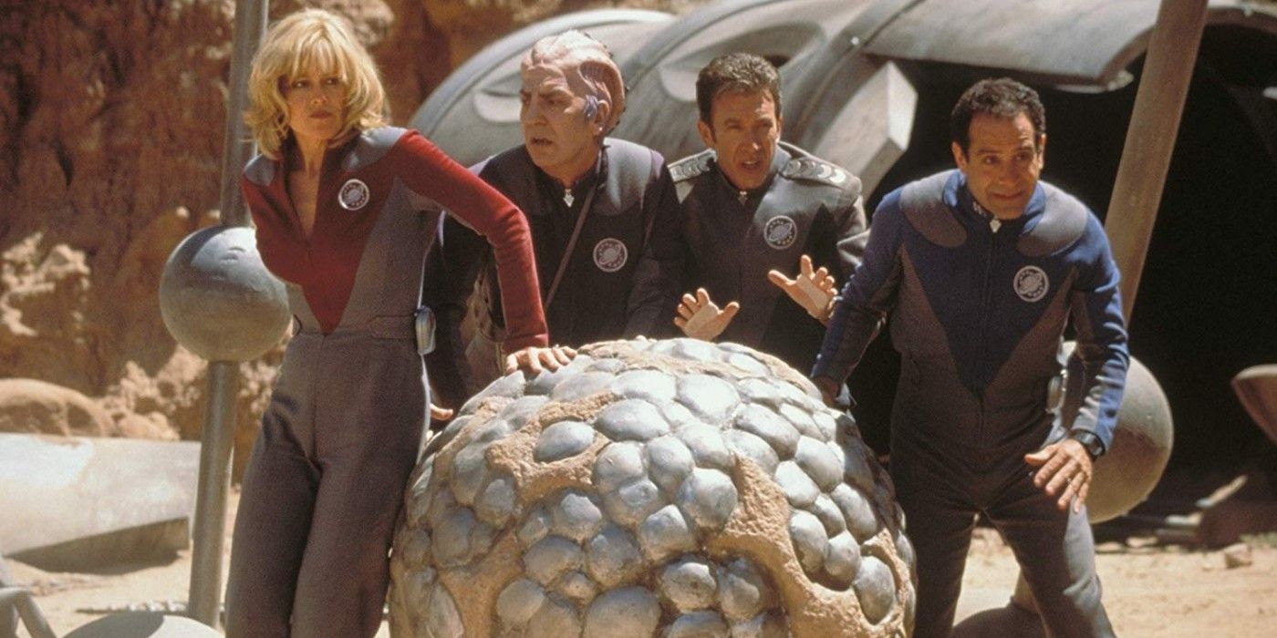 Sigourney Weaver, Alan Rickman, Tim Allen and Tony Shaloub rolling the sphere together in Galaxy Quest