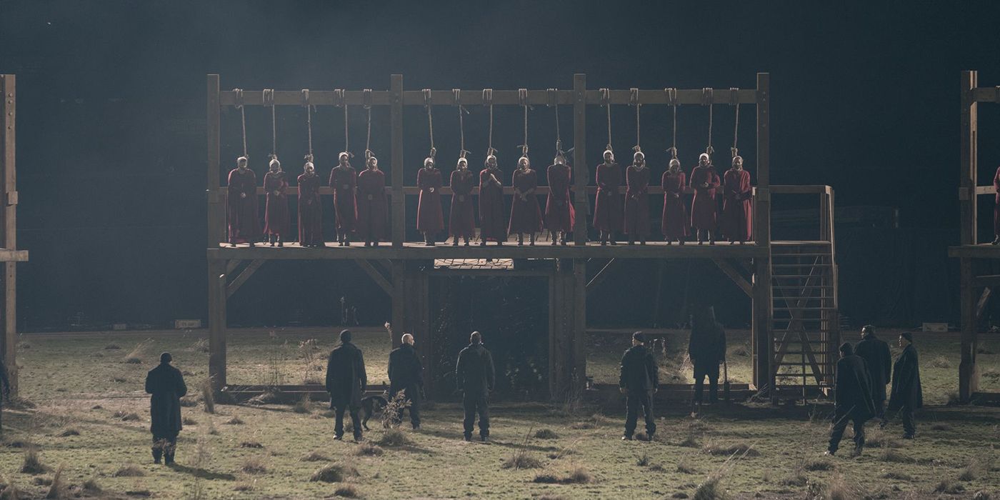 A row of handmaids with nooses around their heads in a scene from The Handmaid's Tale.