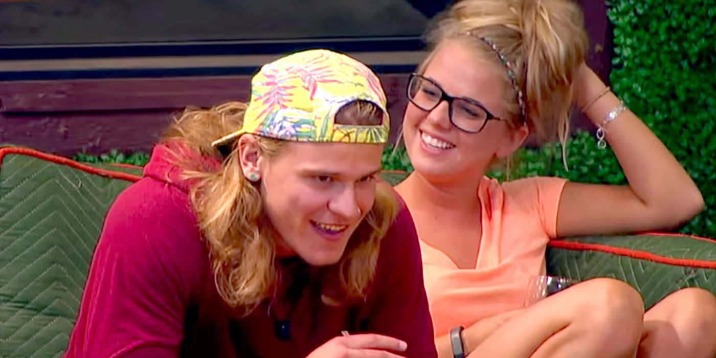 Nicole and Hayden from Big Brother laughing together outside.