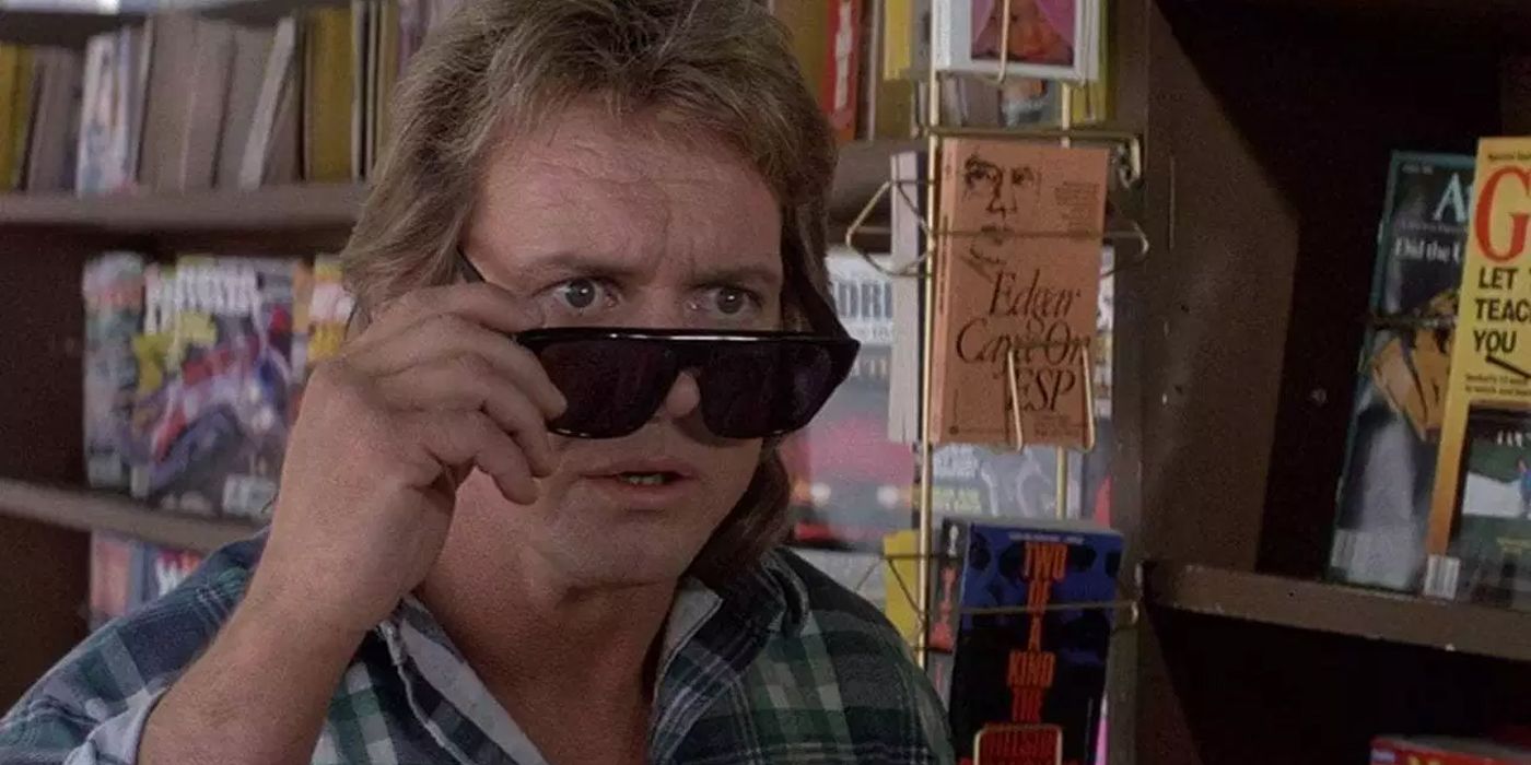 Roddy Piper lowering his glasses in They Live