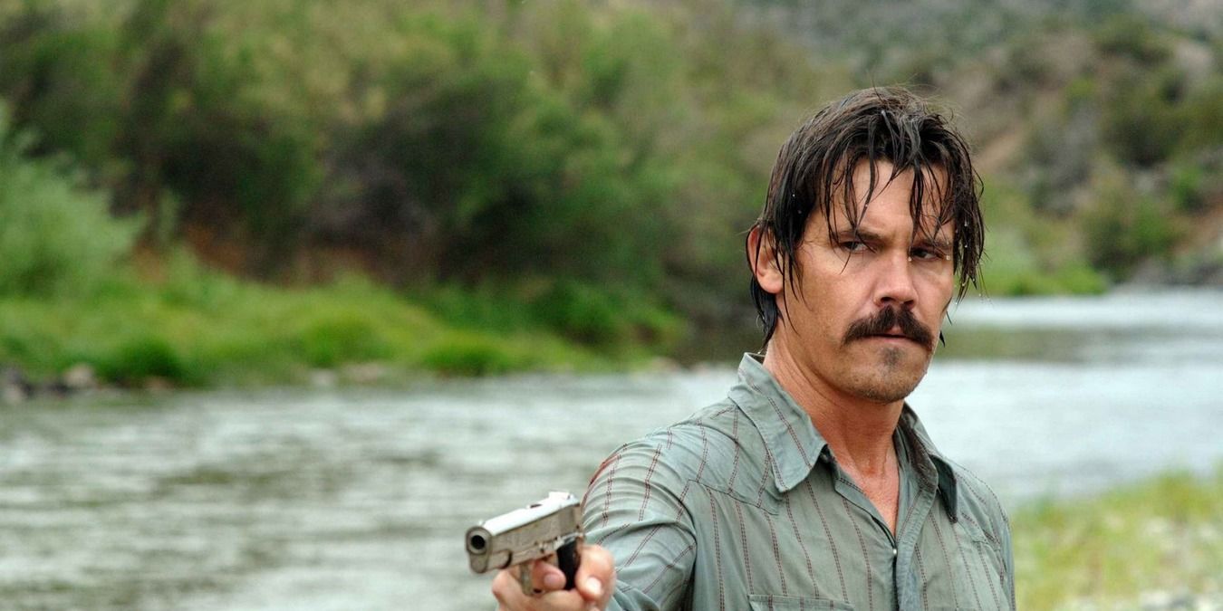 Josh Brolin with a gun in No Country For Old Men.